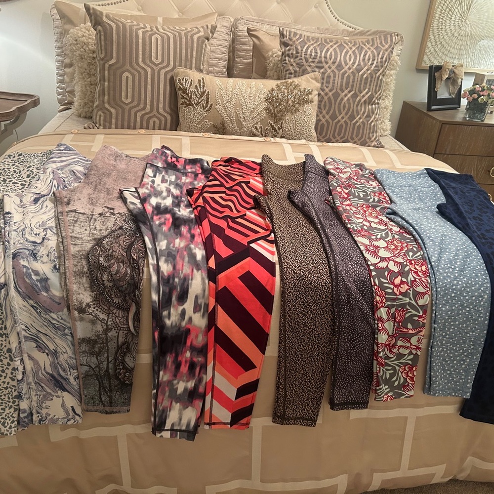 Variety of different leggings all size small, different patterns, and solids.